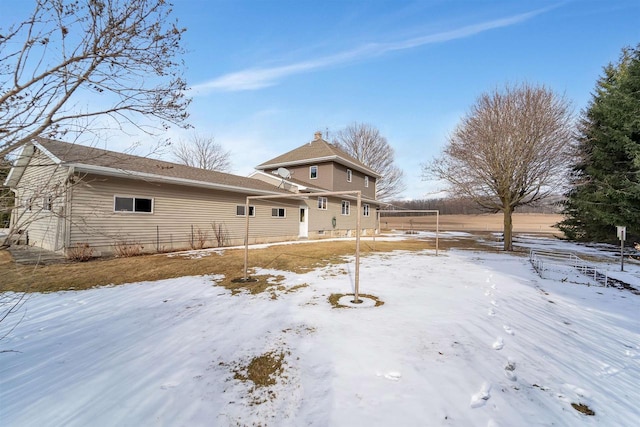 view of snow covered house