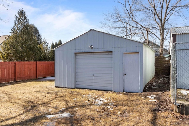 garage with fence