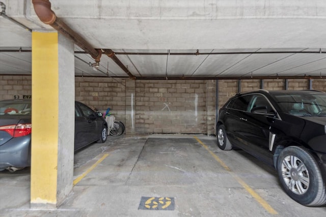 parking deck featuring concrete block wall