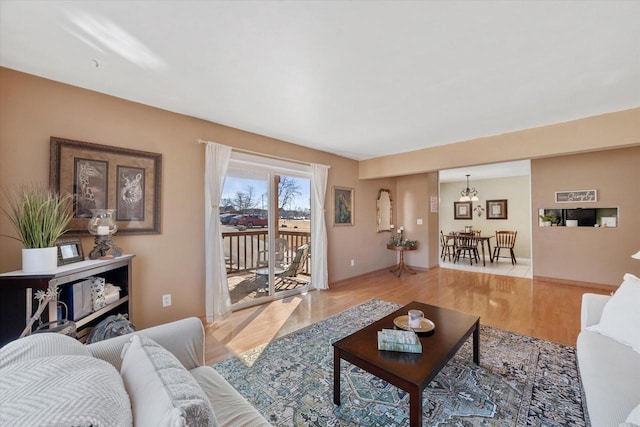 living room with light wood finished floors and baseboards