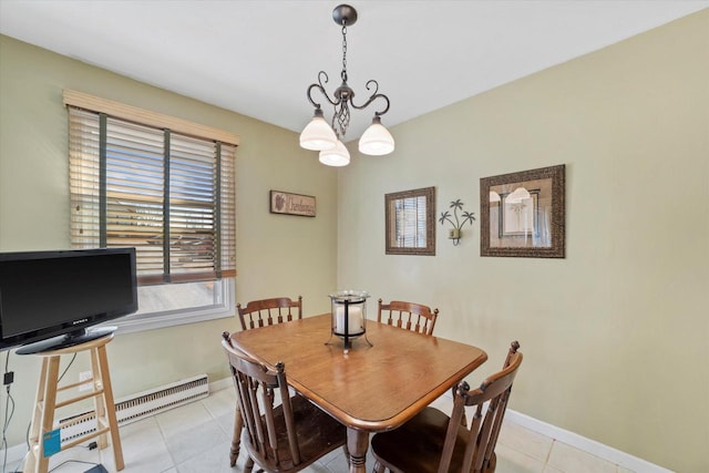 dining area with an inviting chandelier, light tile patterned flooring, and baseboards