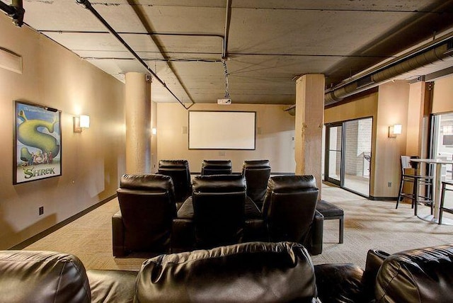 home theater featuring baseboards and carpet