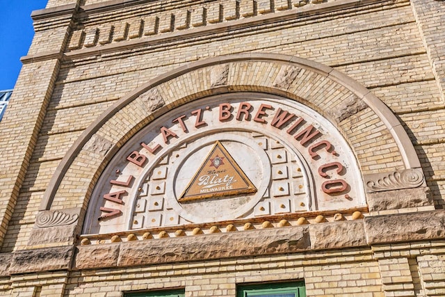 exterior details featuring brick siding