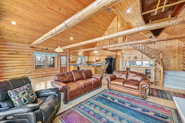 living area featuring beam ceiling, stairway, wood ceiling, and high vaulted ceiling