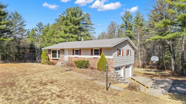 ranch-style house with concrete driveway, an attached garage, and brick siding