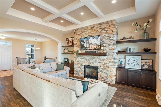 living room with a fireplace, beamed ceiling, dark wood-style floors, and coffered ceiling