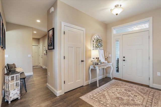 foyer entrance featuring recessed lighting, baseboards, and dark wood finished floors