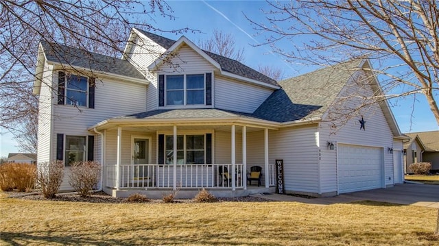 view of front of house with a shingled roof, concrete driveway, a front yard, covered porch, and a garage