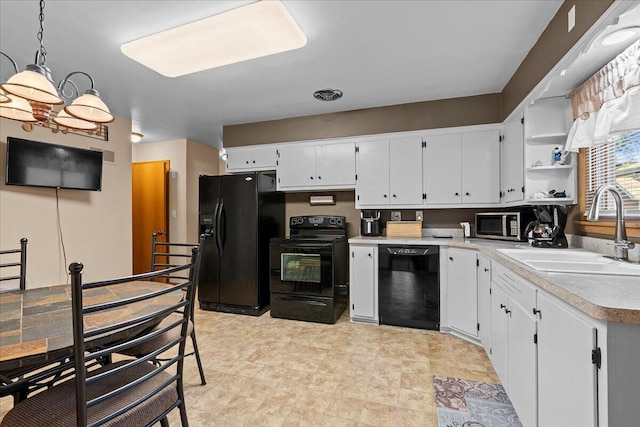 kitchen with visible vents, black appliances, a sink, open shelves, and light countertops