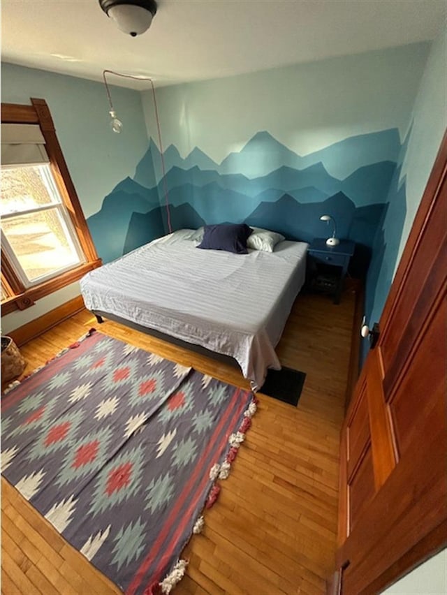 bedroom featuring wood finished floors