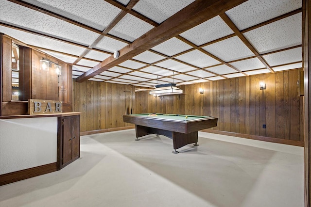 recreation room featuring wood walls, concrete floors, baseboards, and billiards