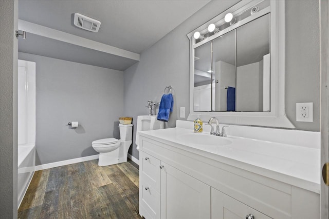 full bath featuring visible vents, toilet, walk in shower, and wood finished floors