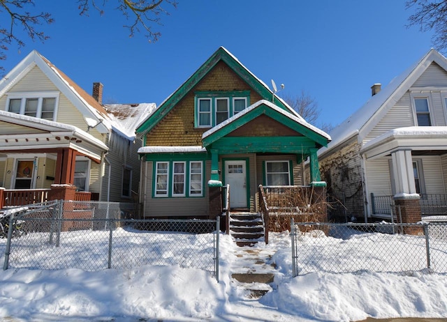 view of front of property featuring a fenced front yard and covered porch