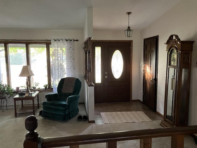 foyer featuring lofted ceiling