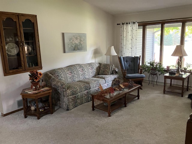 living room with visible vents and baseboards