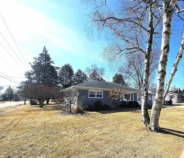 ranch-style house with a front yard