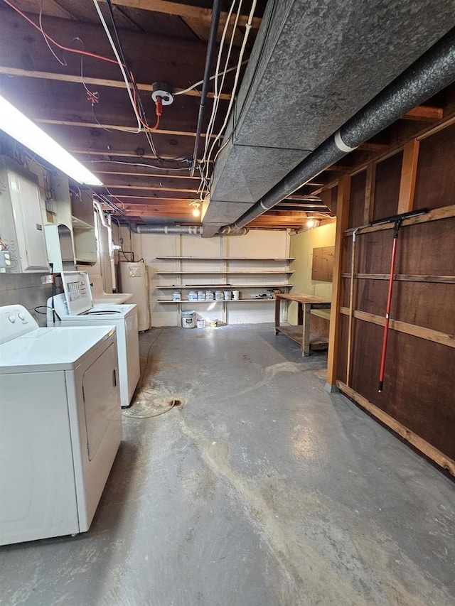 unfinished below grade area with water heater and washing machine and dryer