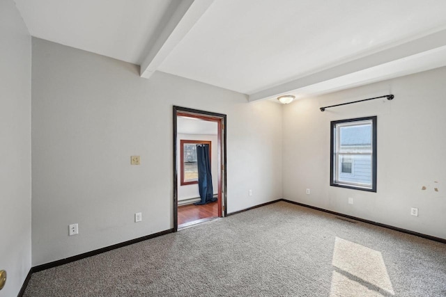 empty room with beamed ceiling, baseboards, and carpet flooring