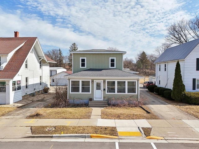 view of front of house with driveway and board and batten siding