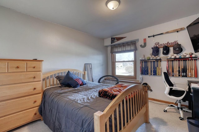 carpeted bedroom featuring baseboards