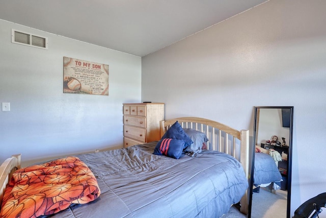 bedroom featuring carpet flooring and visible vents