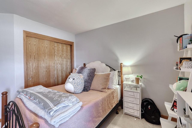 carpeted bedroom featuring a closet