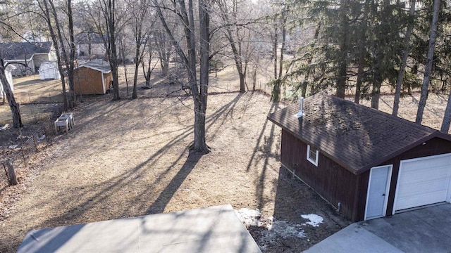 view of yard with an outbuilding and a shed