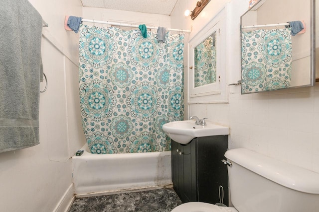 full bath with shower / bath combo with shower curtain, toilet, and vanity