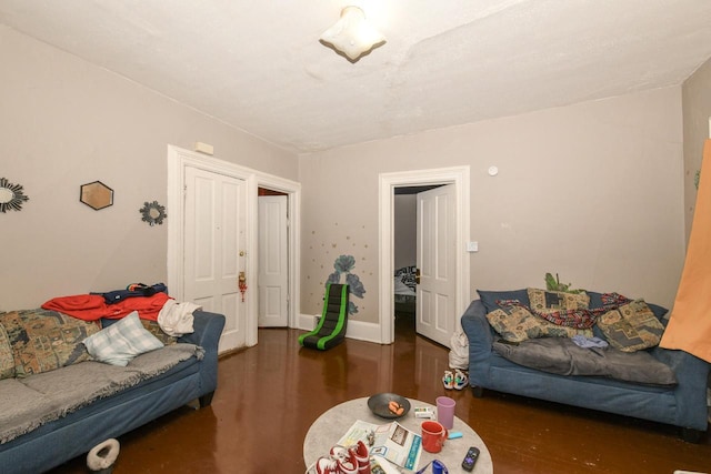 living room featuring baseboards