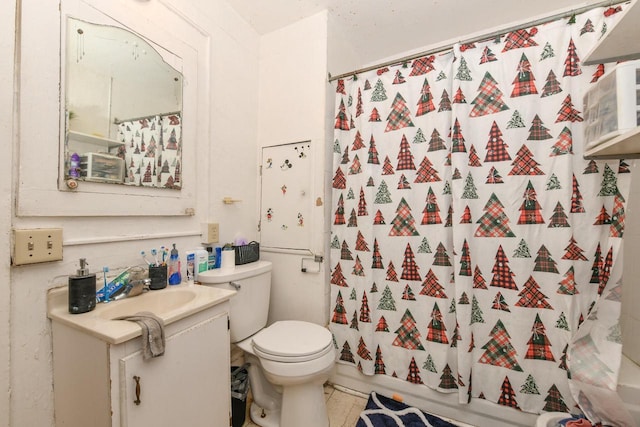 bathroom with toilet, shower / tub combo with curtain, and vanity