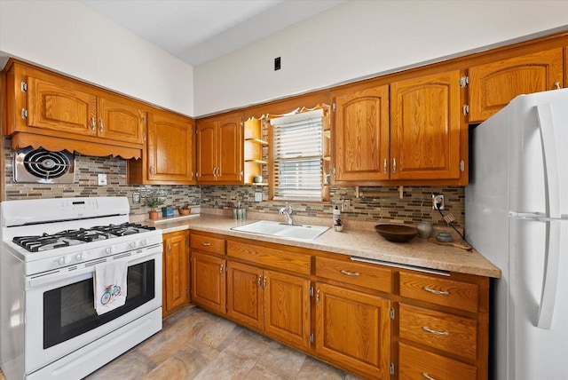 kitchen featuring light countertops, decorative backsplash, brown cabinets, white appliances, and a sink