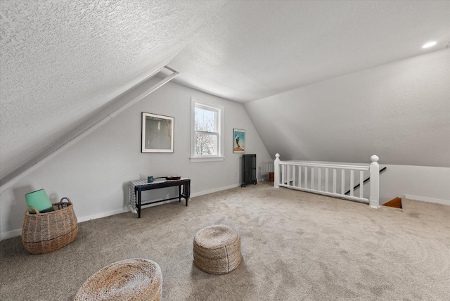 bonus room with baseboards, a textured ceiling, carpet, and vaulted ceiling