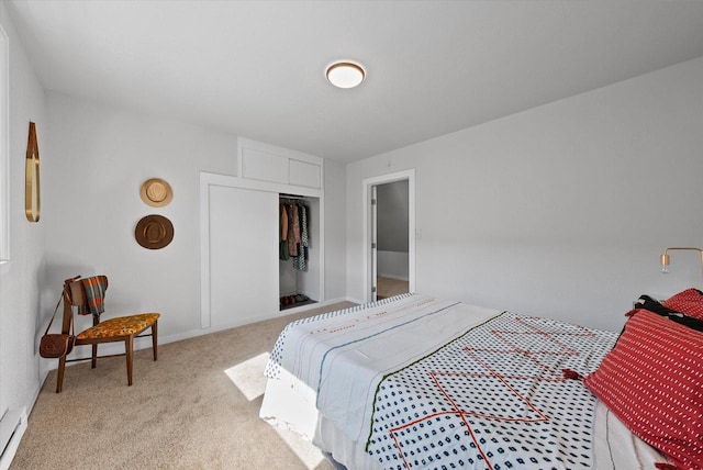 bedroom with a baseboard radiator, a closet, and carpet flooring