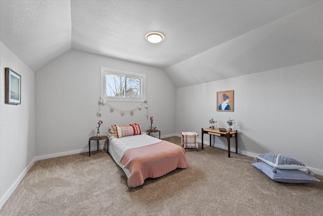 bedroom featuring baseboards, carpet floors, a textured ceiling, and vaulted ceiling