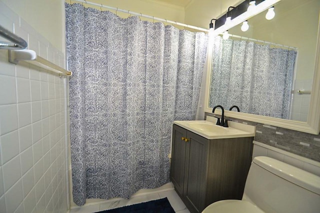 full bathroom with vanity, a shower with curtain, tile walls, toilet, and tile patterned floors