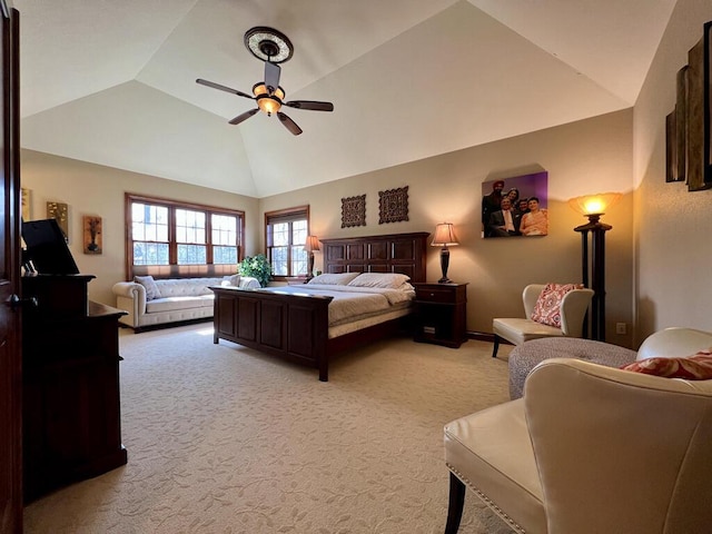 bedroom with light carpet, ceiling fan, and vaulted ceiling