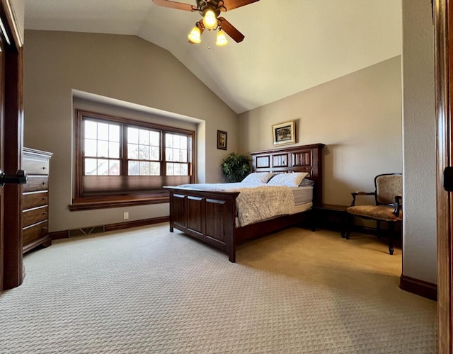 bedroom with baseboards, lofted ceiling, carpet, and a ceiling fan