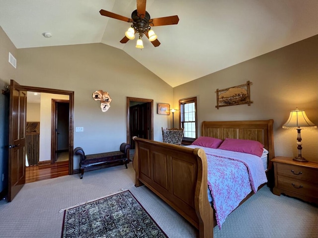 bedroom with light carpet, visible vents, a ceiling fan, and lofted ceiling