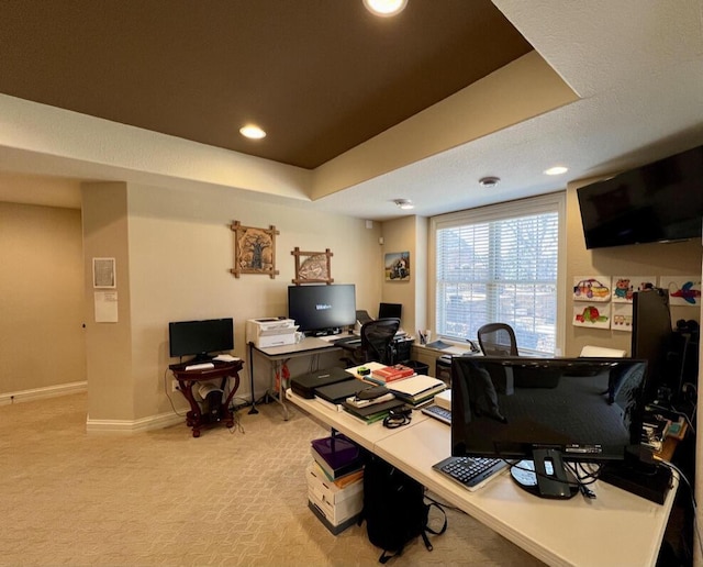 home office featuring recessed lighting, baseboards, a raised ceiling, and carpet flooring