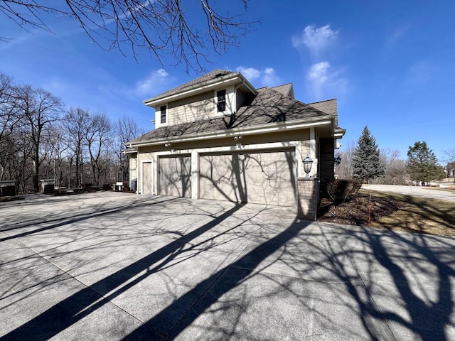 garage with concrete driveway