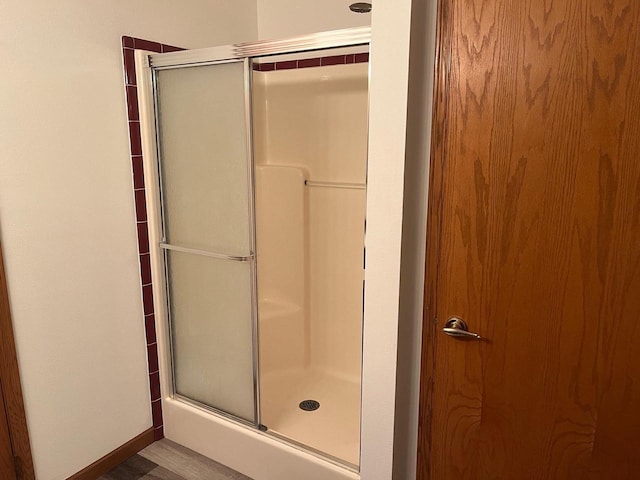 full bathroom with a shower with shower door