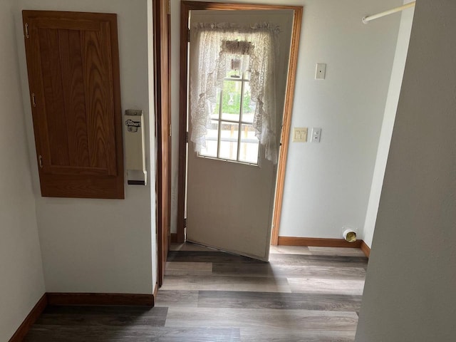 interior space with wood finished floors and baseboards