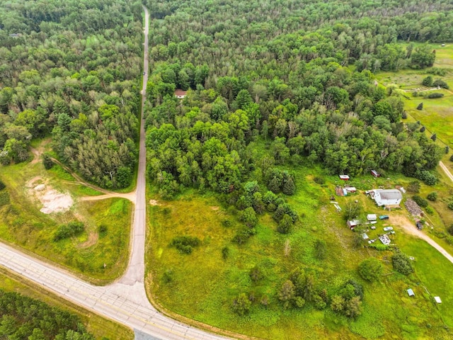 aerial view featuring a forest view