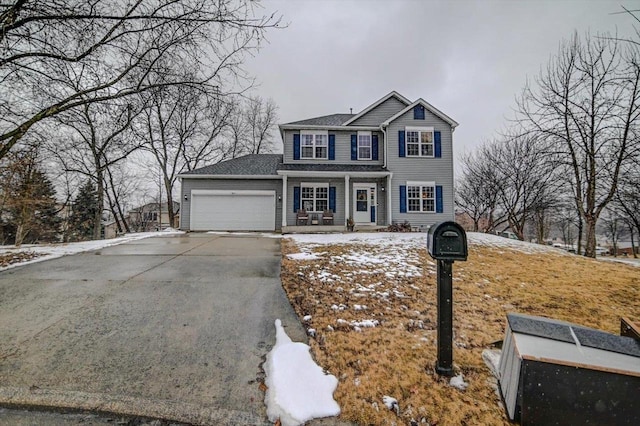 view of front of home featuring aphalt driveway and an attached garage