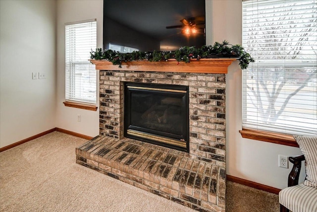 room details featuring carpet flooring, a fireplace, and baseboards