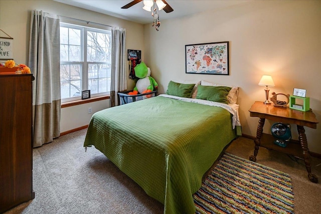 carpeted bedroom with baseboards and a ceiling fan