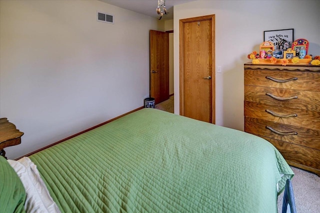 bedroom featuring visible vents, carpet floors, and baseboards