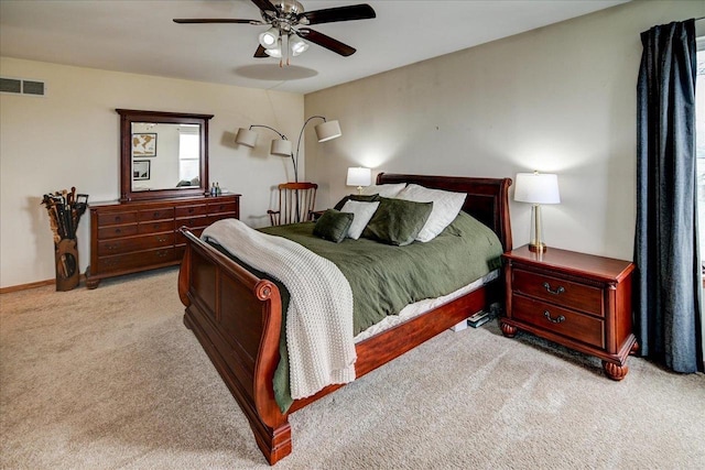 carpeted bedroom with visible vents and ceiling fan