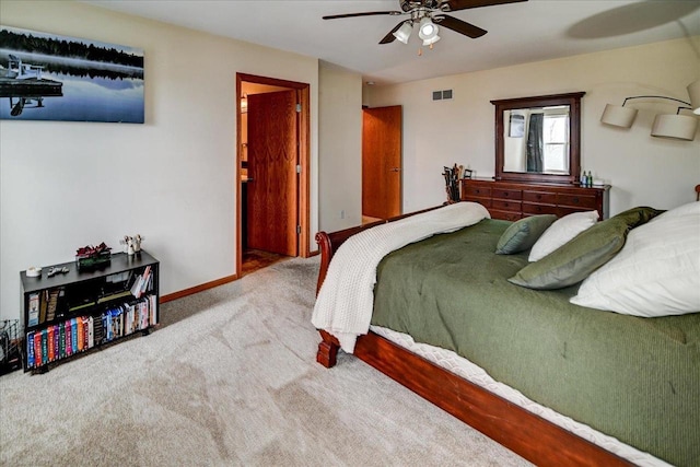 bedroom with baseboards, carpet floors, visible vents, and a ceiling fan