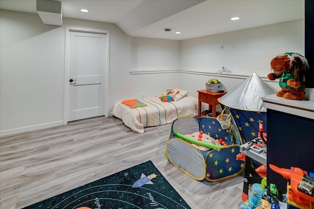 bedroom featuring recessed lighting, wood finished floors, and baseboards